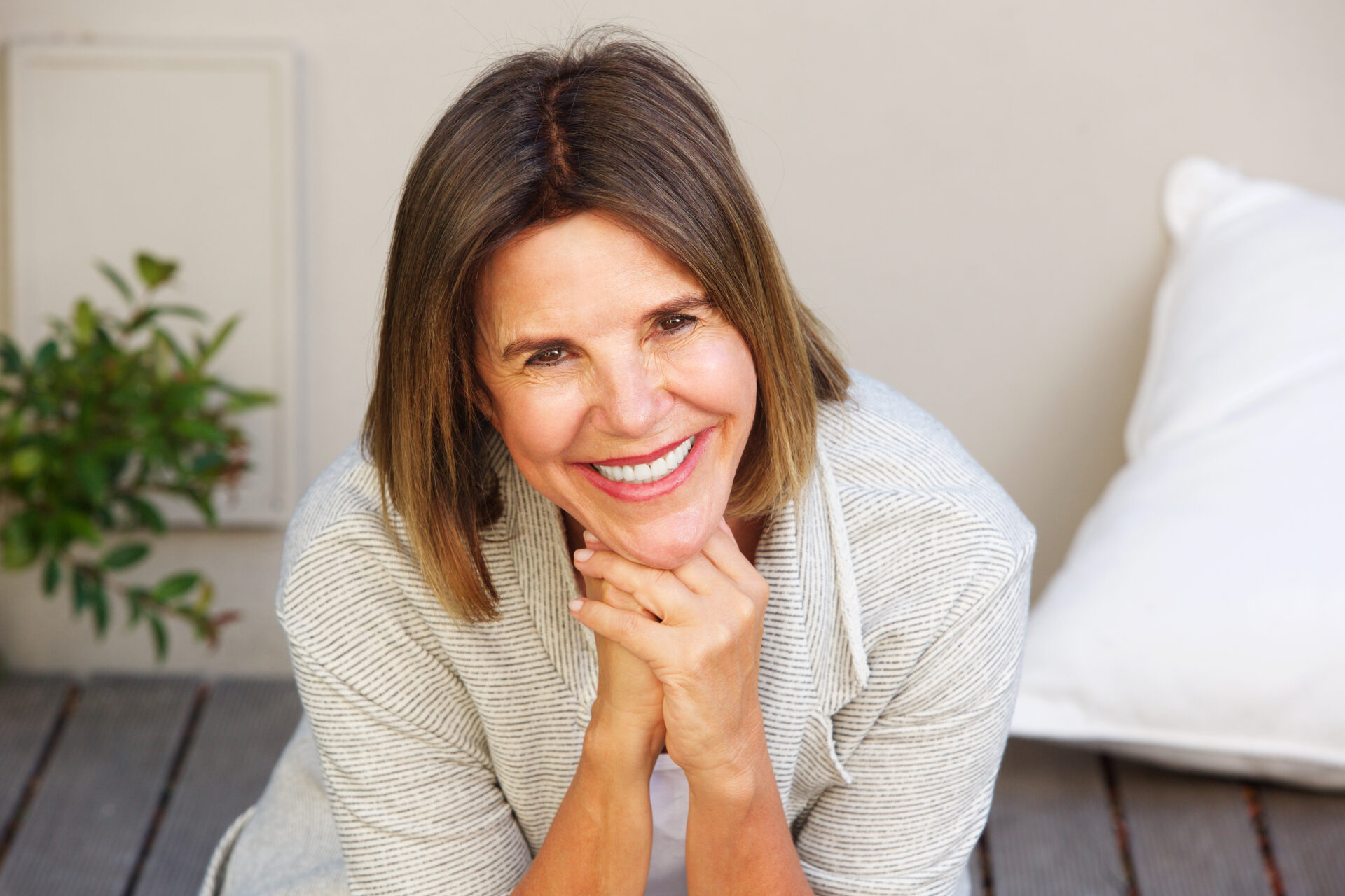 smiling older woman sitting outside